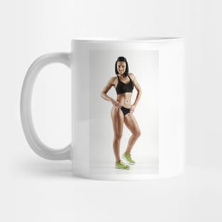 Young female fitness model on white Mug